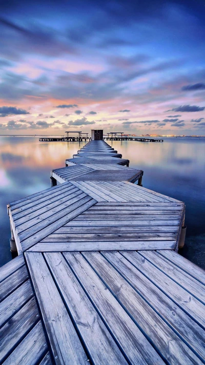 Serene Wooden Pier Under Azure Skies at Dusk