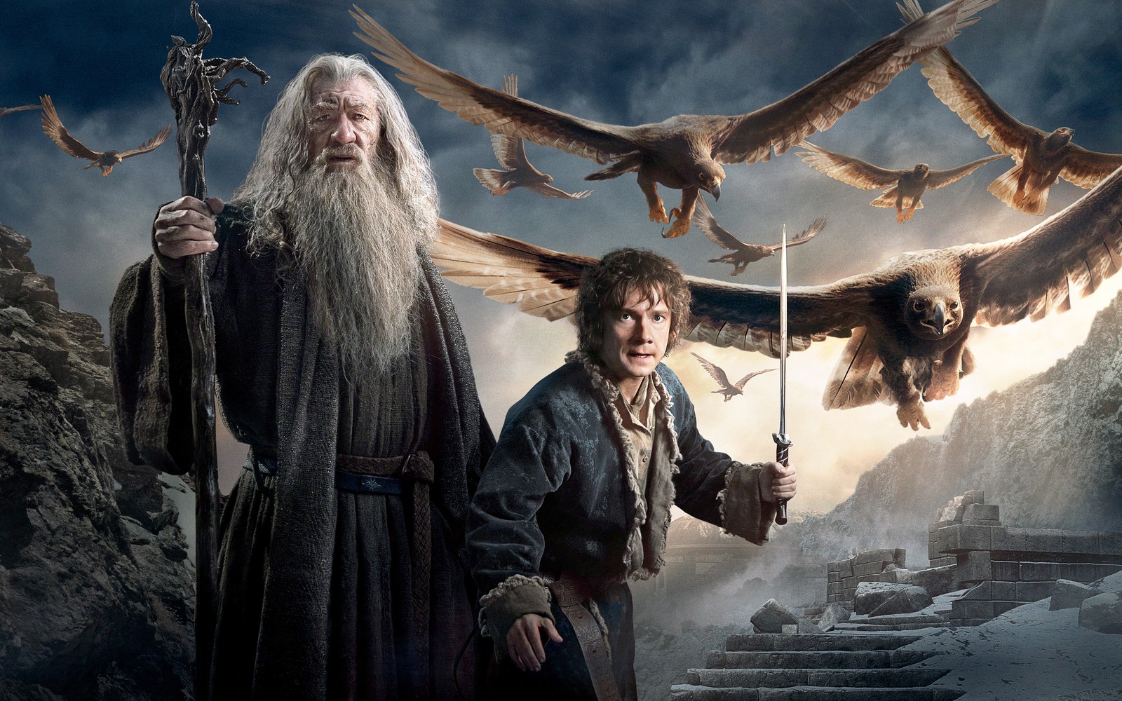 Le hobbit et gandalf se tiennent devant une montagne avec des oiseaux (bilbo baggins, gandalf, le hobbit, obscurité, thorin écu de chêne)