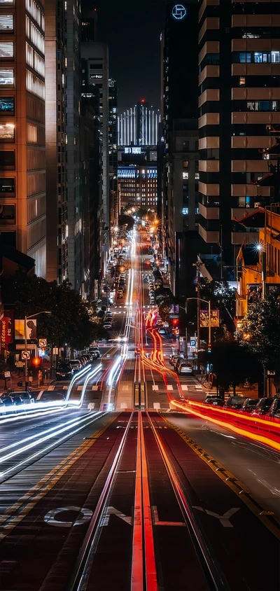 Illuminated Streets of San Francisco: A Nighttime View of Skyscrapers and Automotive Lighting