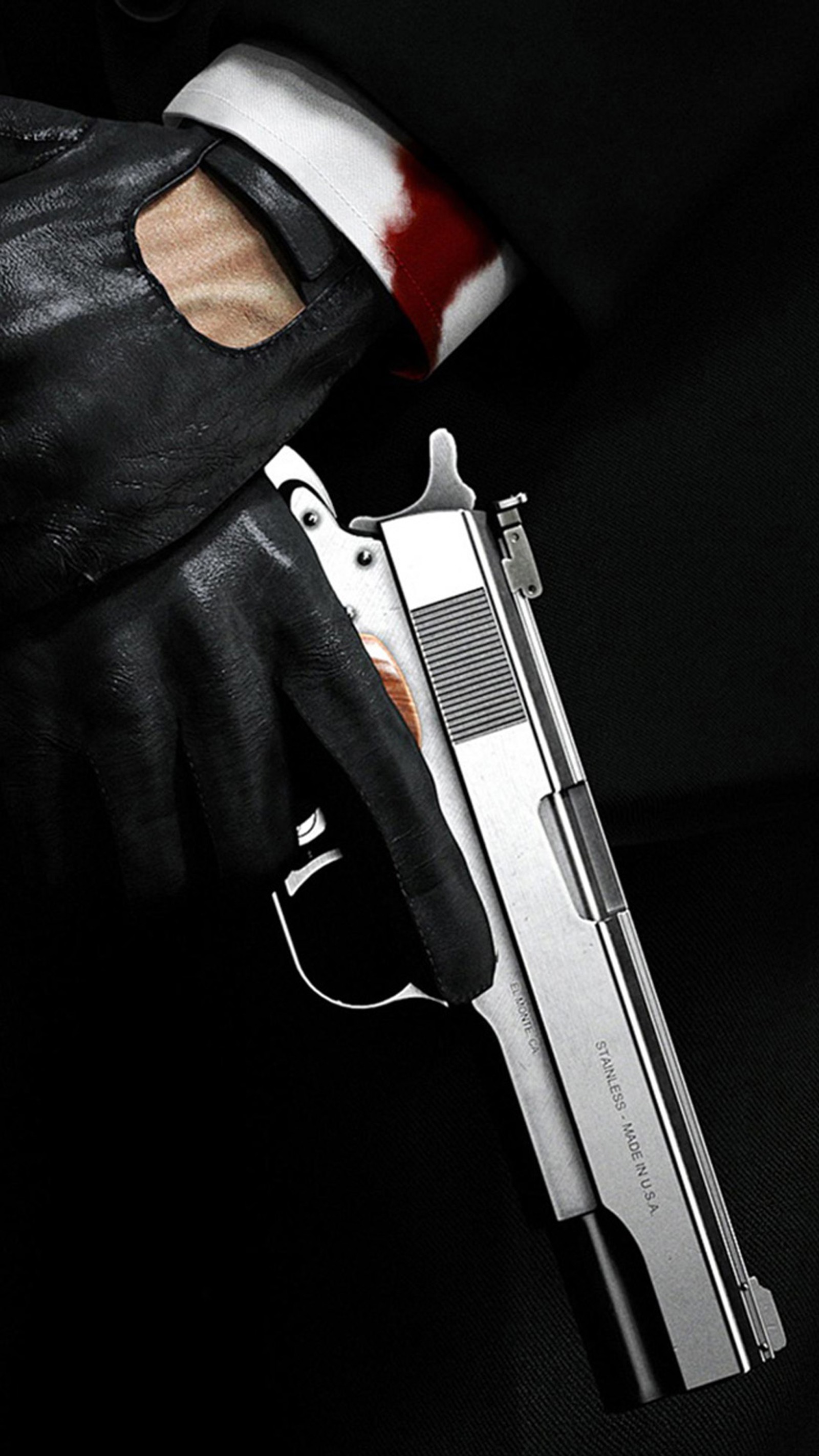 Arafed gun in a glove with blood on it (blood, gun, hitman)