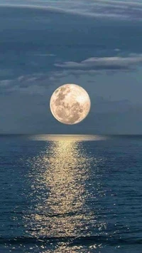 Illuminated Moon Over Calm Waters