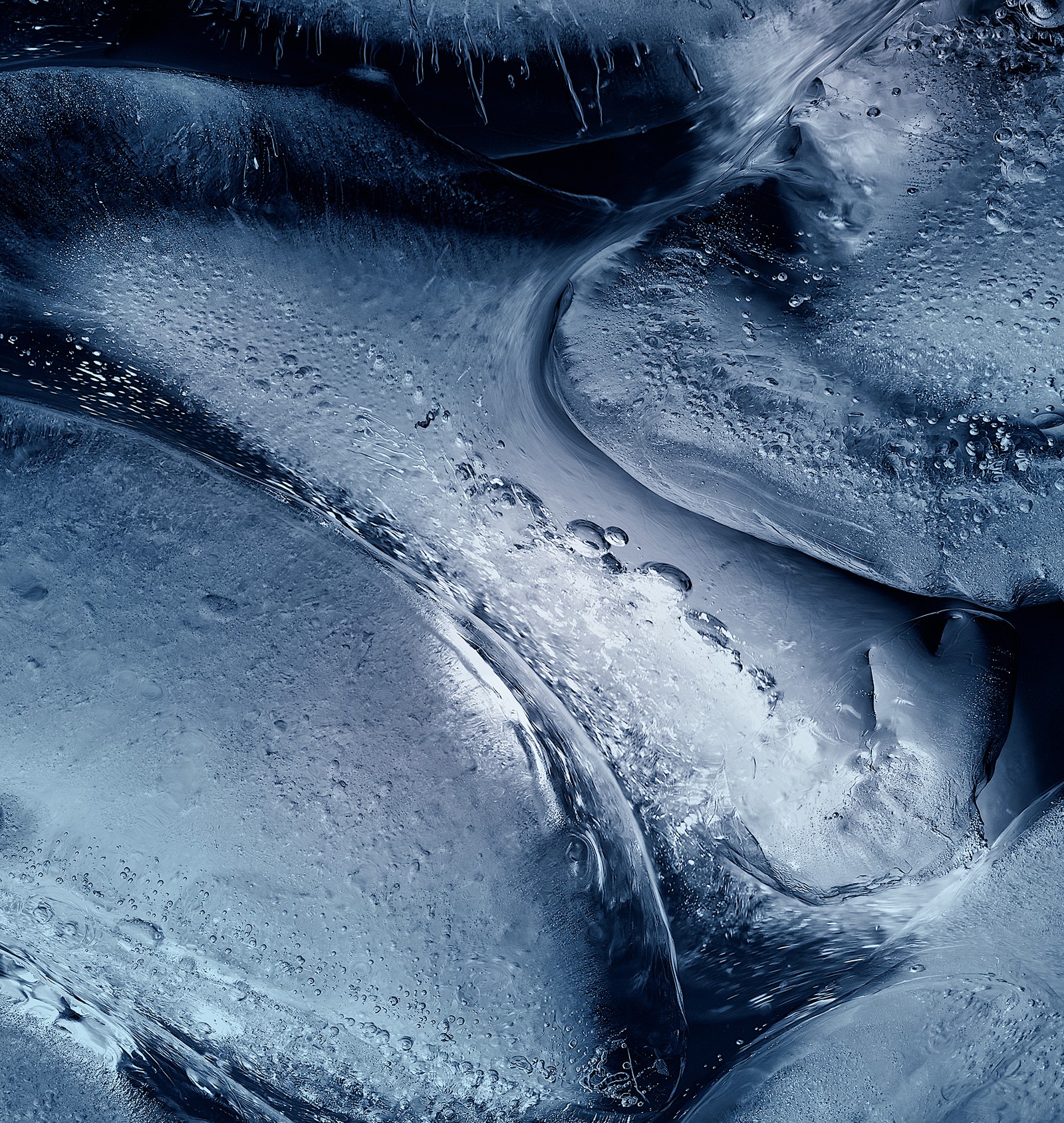 A close up of a bunch of ice cubes with water droplets (android, background, freeze, ice, macro)