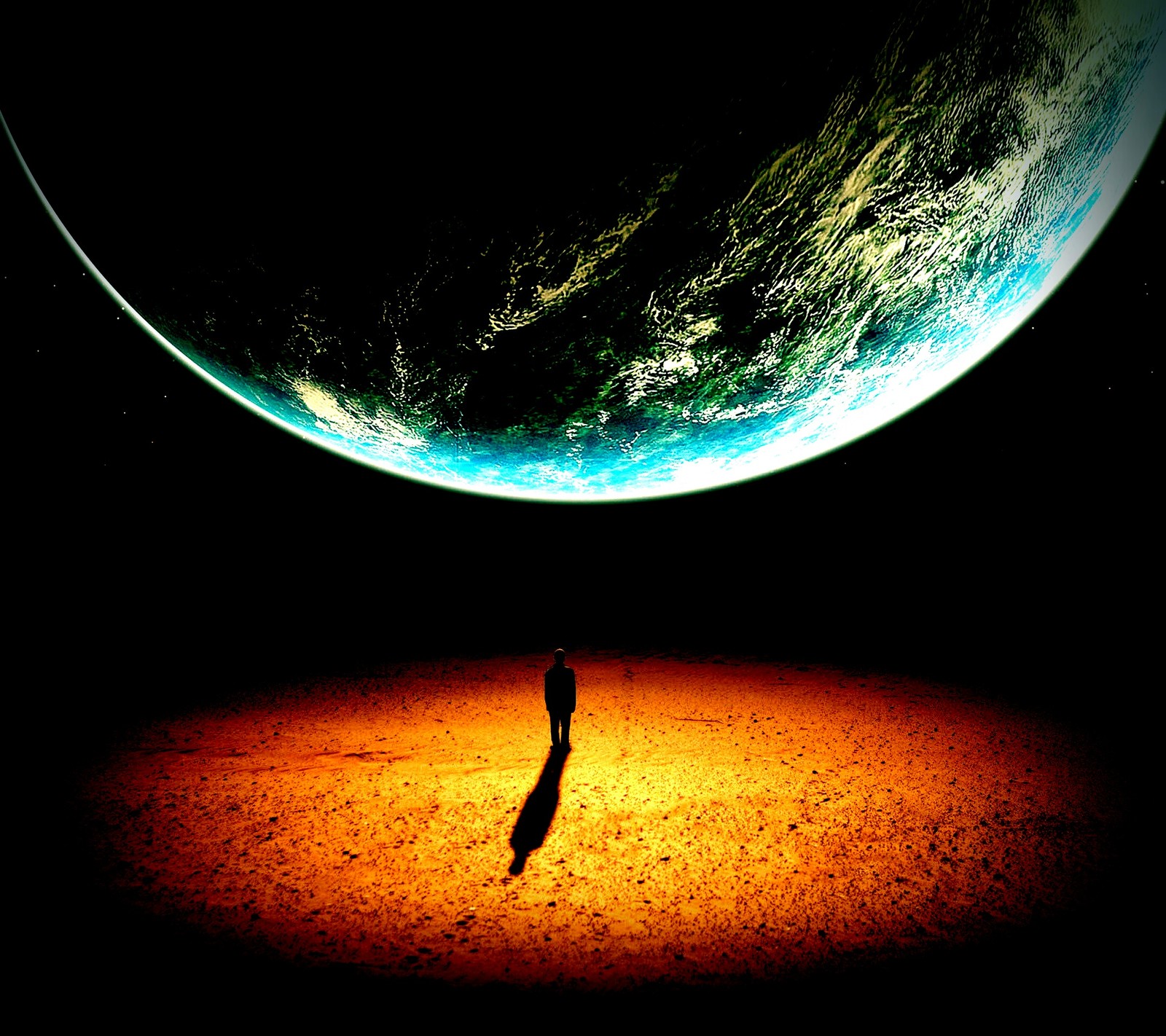 There is a person standing in the middle of a desert area (earth, univers)