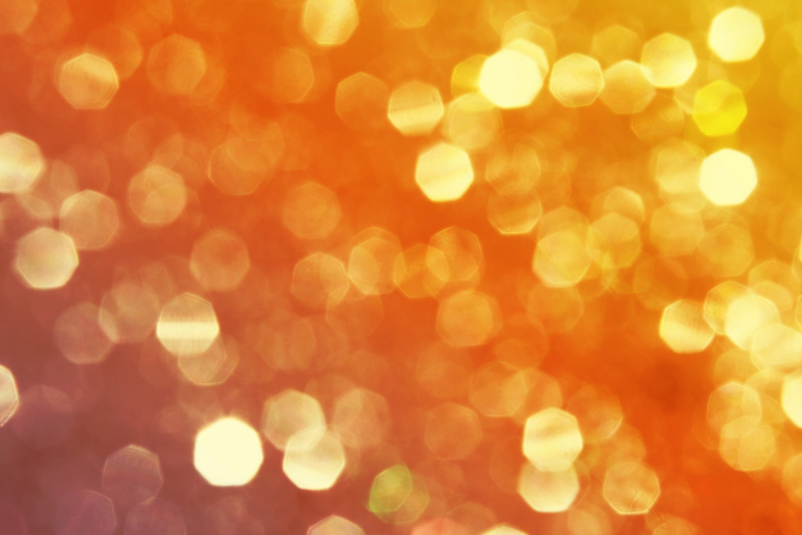 A close up of a blurry background of a yellow and red light (orange, yellow, light, sunlight, price)