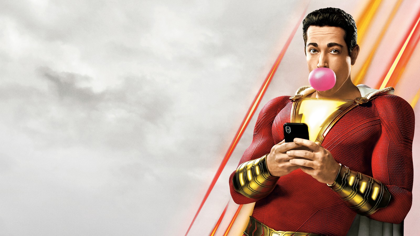 Un homme girafe en chemise rouge soufflant une bulle avec un téléphone (shazam 2019, film, shazam, zachary levi)