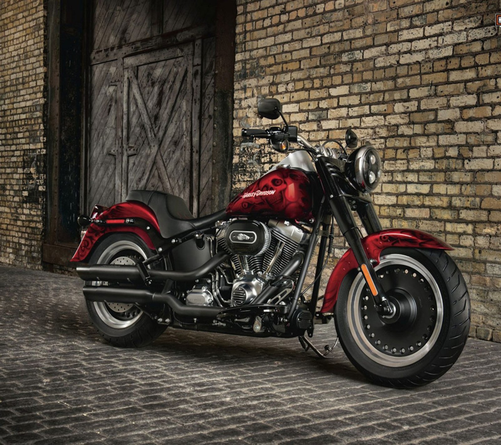 A close up of a red motorcycle parked in front of a brick building (car, cars, nfs, race, road)