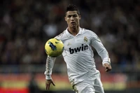 Cristiano Ronaldo in action, dribbling the ball while playing for Real Madrid.