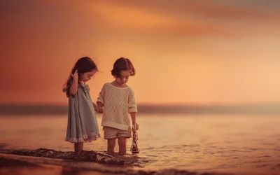 Joyful Playtime by the Shore: A Girl and Boy Embrace Sunlit Moments