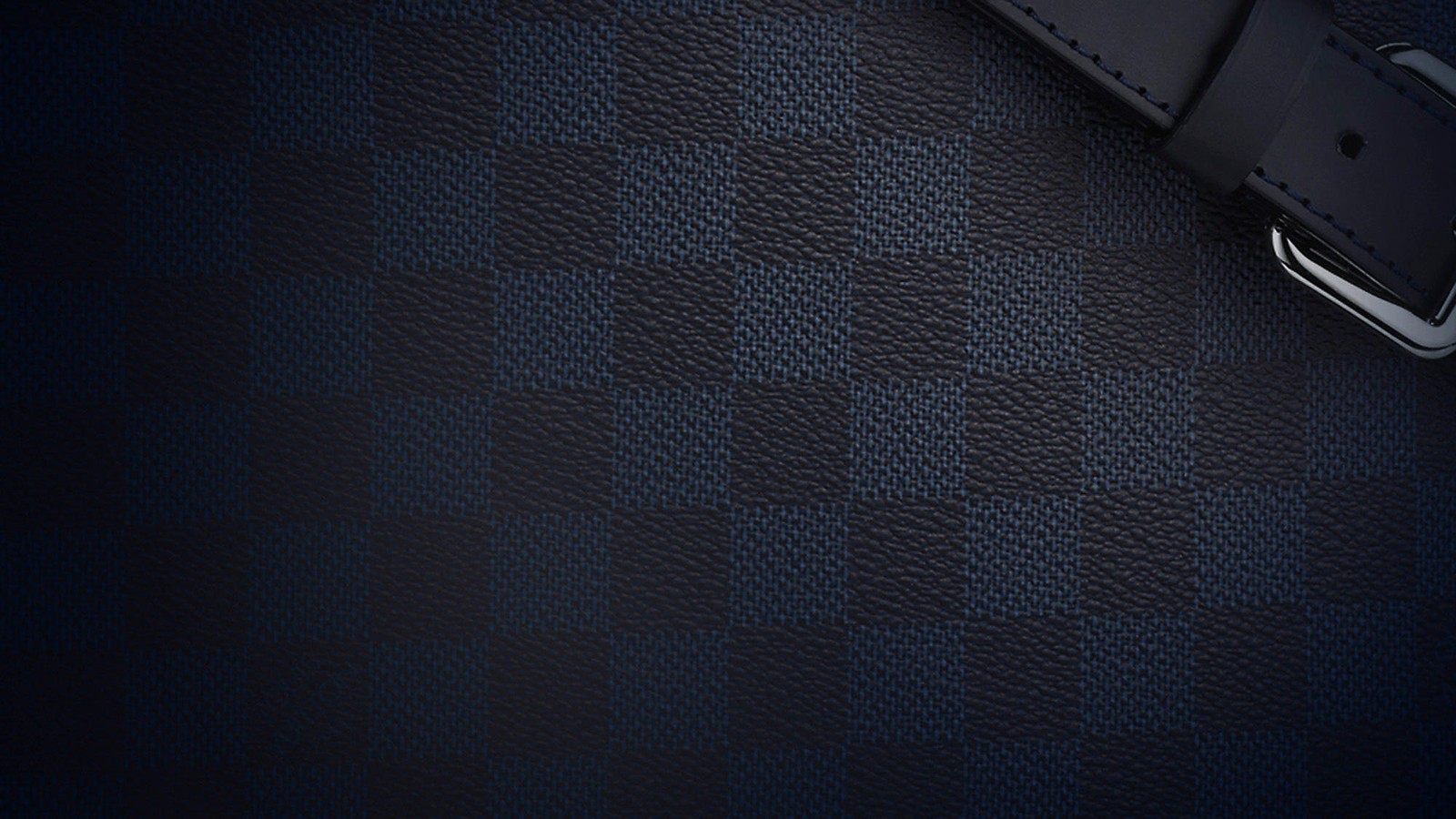 A close up of a belt on a black leather surface (black, pattern, angle, blue, line)