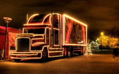 Camion festif Coca-Cola illuminé pour la nuit de Noël