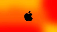 Schwarzes Apple-Logo auf einem lebhaften rot-gelben Farbverlauf-Hintergrund