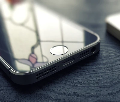 Close-up of an iPhone 5s showcasing its sleek design and reflective screen.