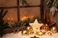 Elegant Gold Christmas Ornaments and Decor on a Snowy Window Sill