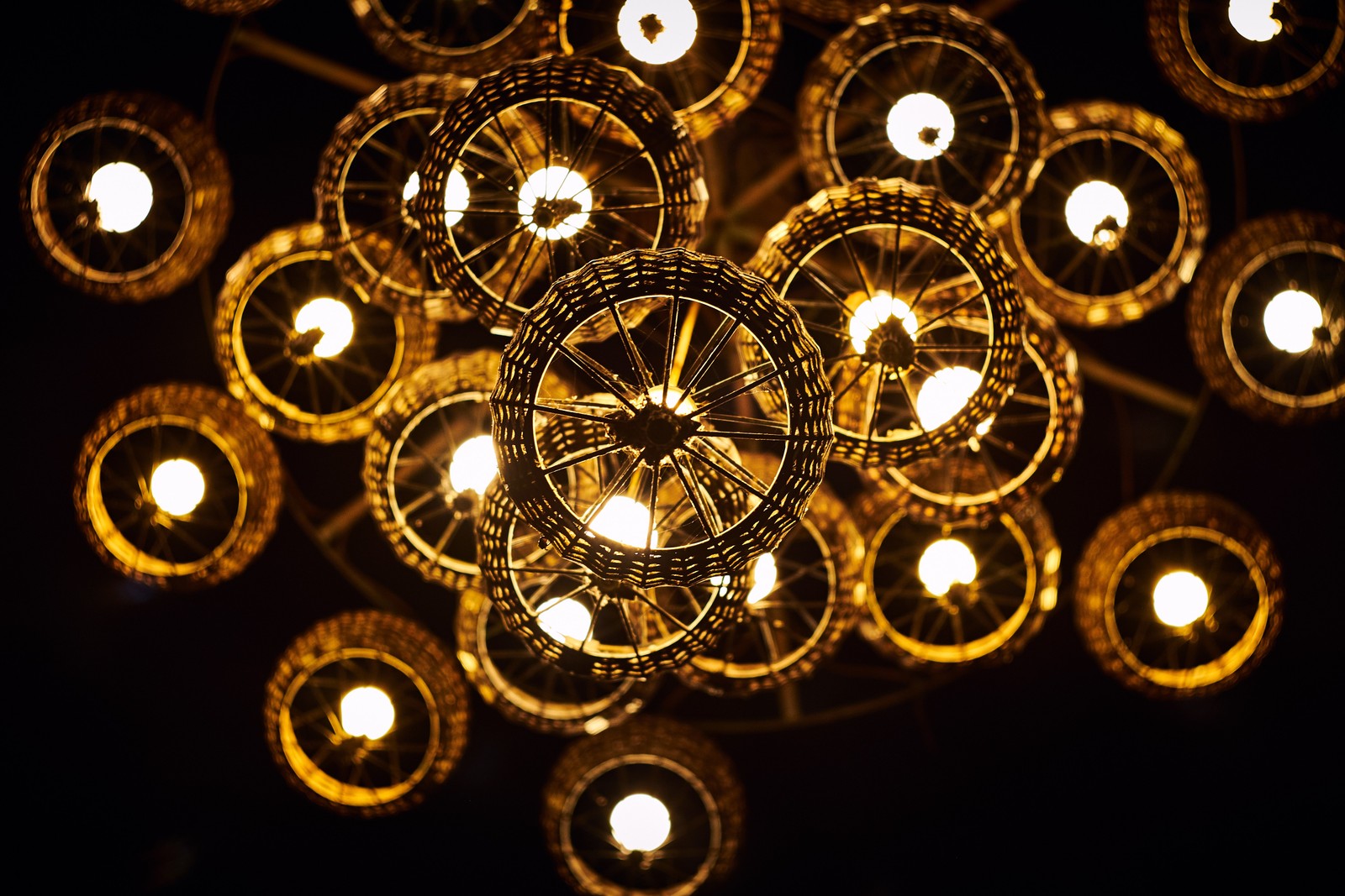 A close up of a light fixture with many lights in it (lighting, chandelier, circle, ceiling, lighting accessory)