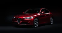 2021 Alfa Romeo Giulia auf dunklem Hintergrund - 4K Hintergrundbild