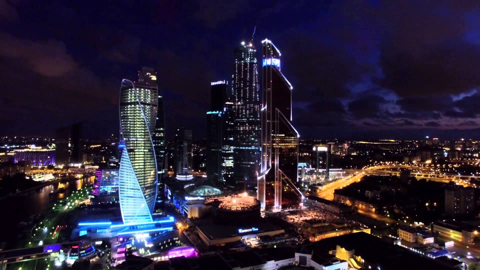 A view of a city at night with a lot of lights (night, cityscape, city, urban area, metropolis)