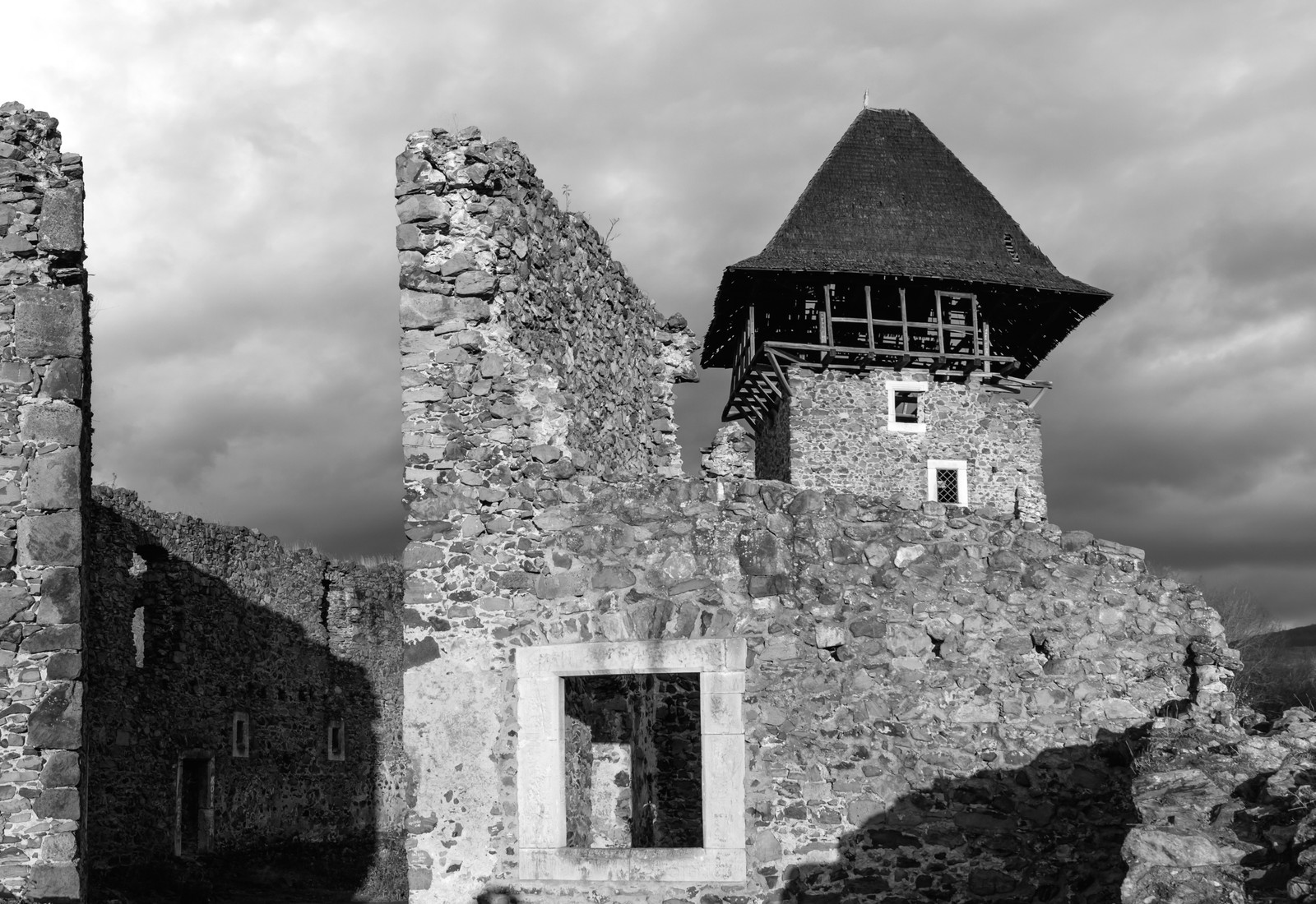 A black and white photo of a castle with a tower (castle, black and white, middle ages, medieval architecture, ruins)