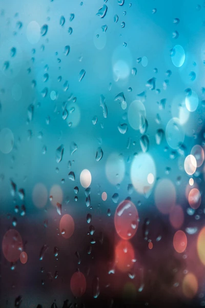 Gouttes de pluie turquoise sur fond bokeh