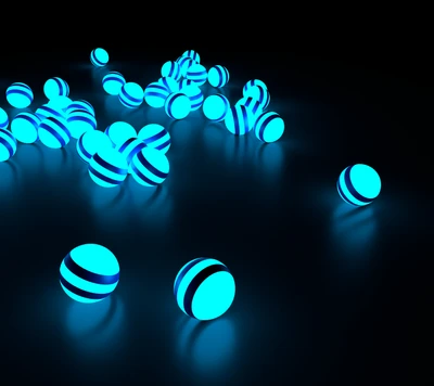 Sphères turquoise luminescentes réfléchissant la lumière dans l'obscurité