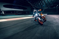 KTM 1290 Duke Superbike in Action at Night on a Racing Circuit