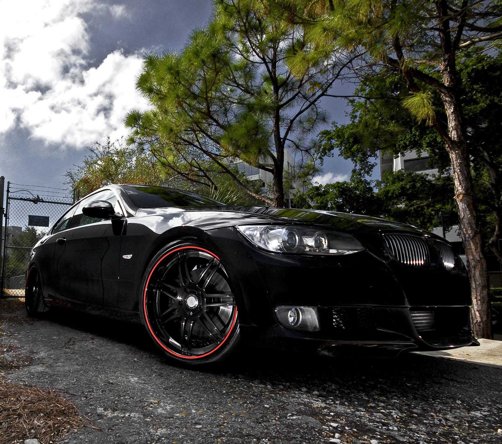 Arafed black car parked on a gravel road near a fence (335i, bmw, car, m3, modified)