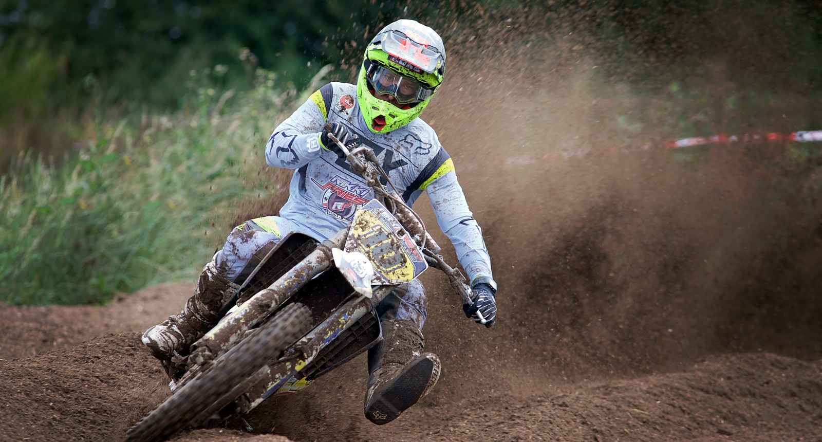 Arafed motorcyclist riding on dirt track in open area (motocross, motorcycle, sports, racing, motorsport)