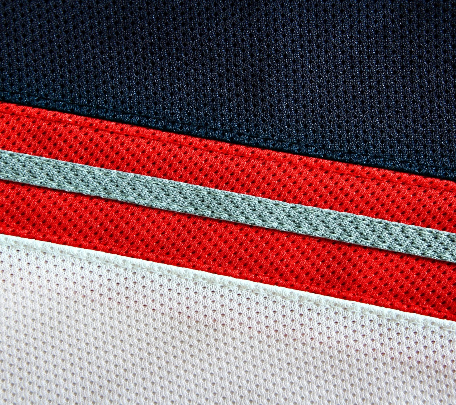 A close up of a red and white jersey with a black stripe (abstract, carbon, gs5, htc, m7)