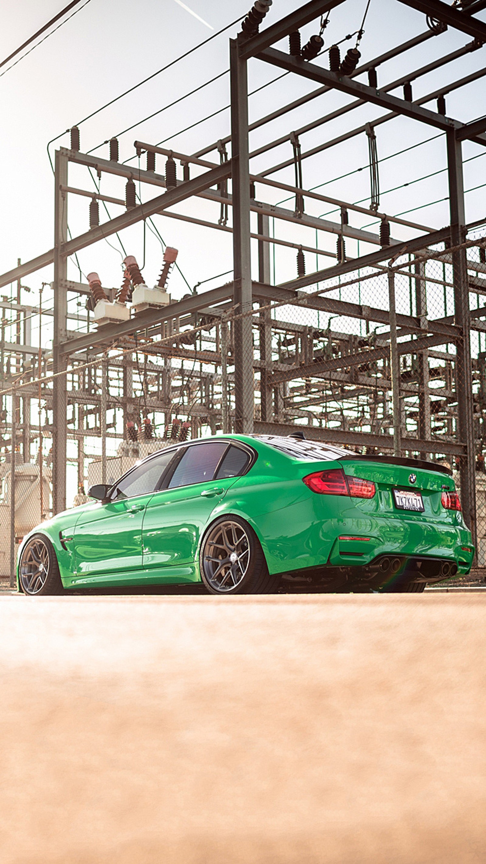 Arafed green bmw car parked in front of a large structure (bmw, green, kermit, m3)