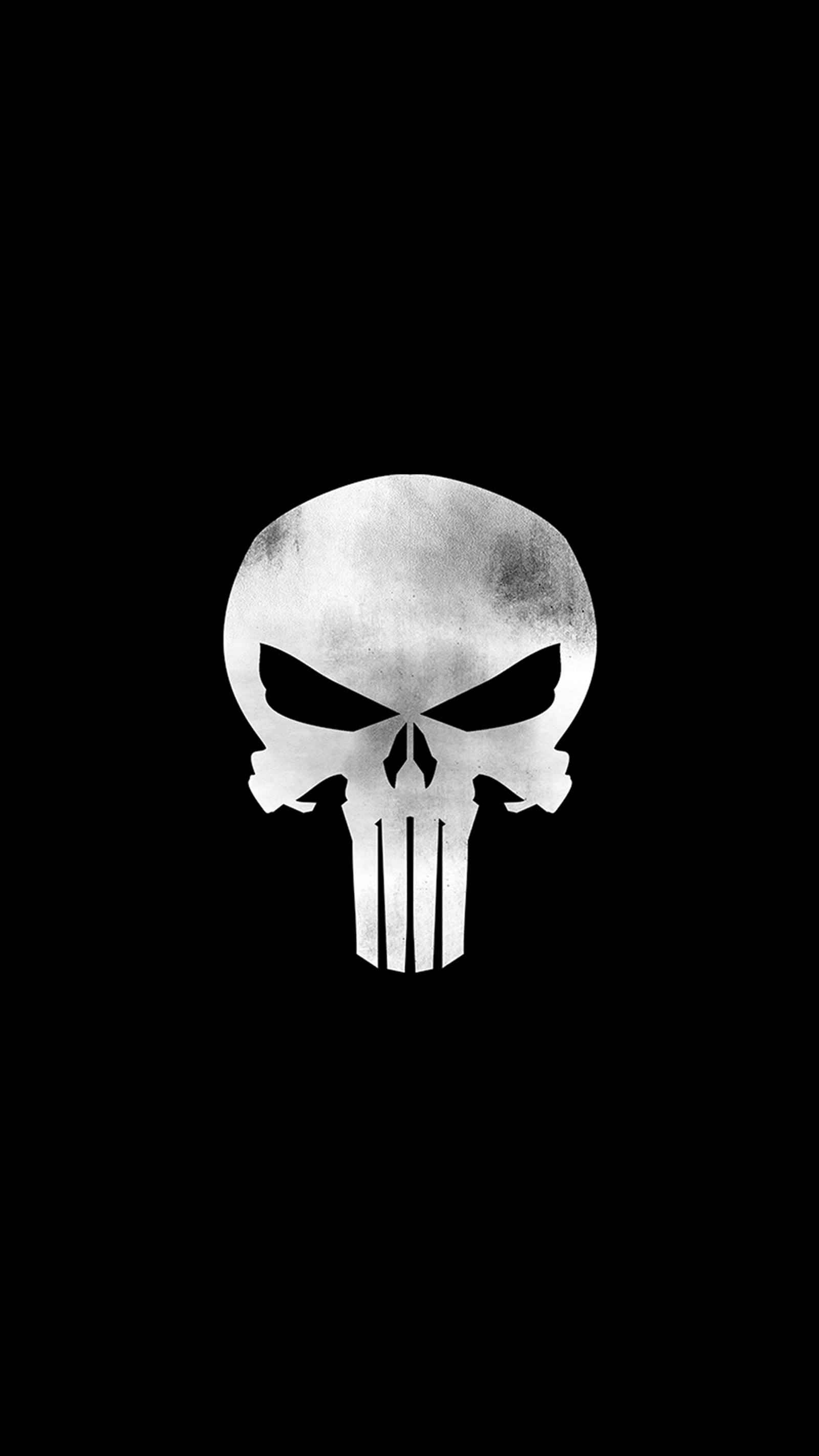 A black and white photo of a skull on a black background (punisher, punisherlogo)