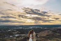 Romantic Embrace Against a Scenic Mountain Horizon