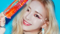 Yuna from ITZY Radiates Joy with Colorful Candy and Sparkling Eyes