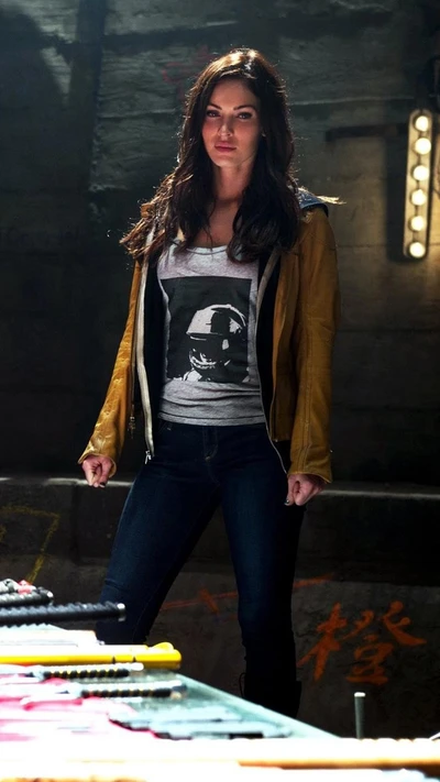 Megan Fox as April O'Neil in a gritty, action-packed scene from TMNT.