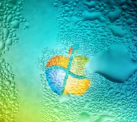 Logotipos de Apple y Windows fusionados con gotas de agua