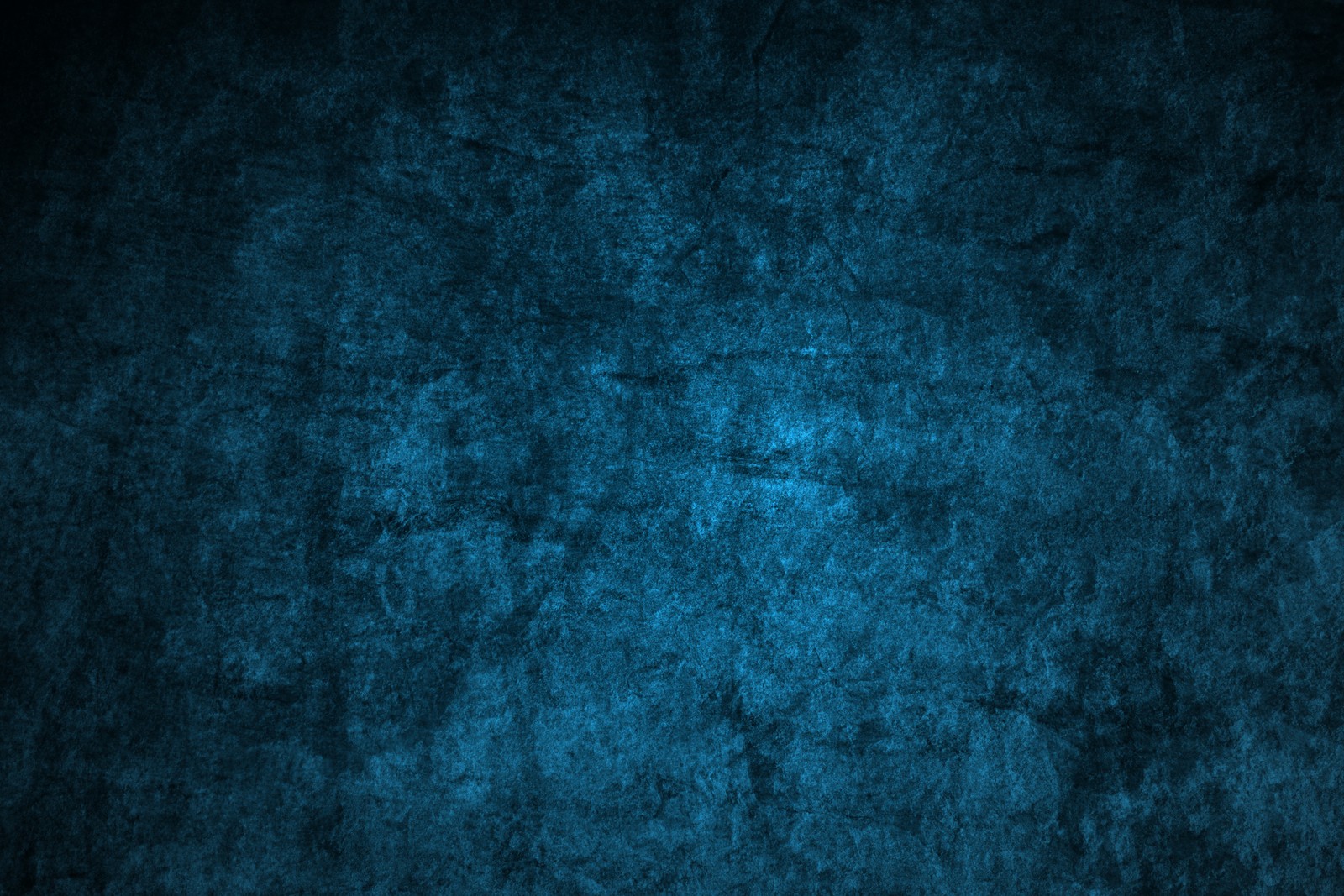 A dark blue background with a rough texture (blue, green, turquoise, teal, azure)