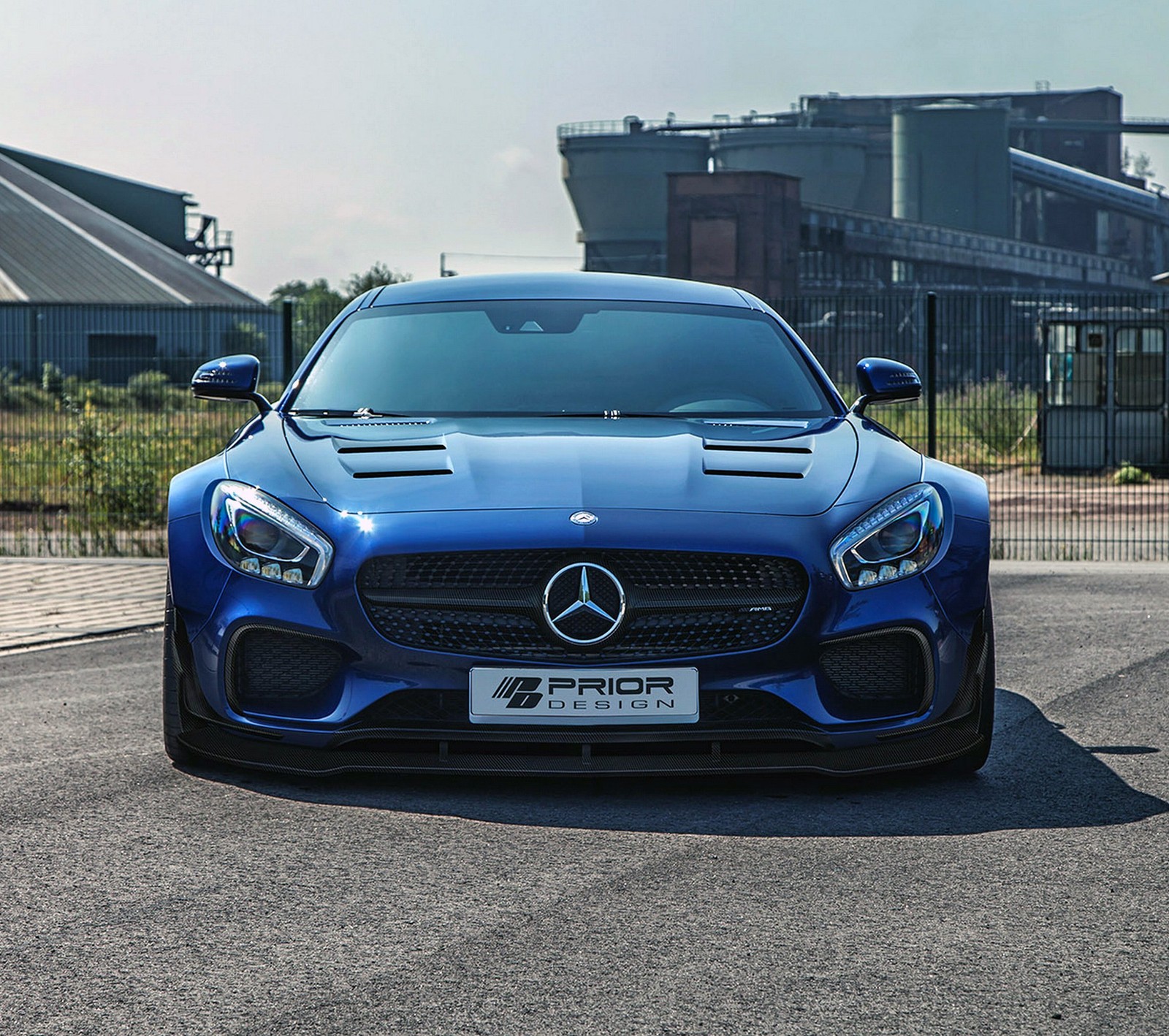 A close up of a blue mercedes sports car parked on a street (blue, germany, mercedes benz, tuned)