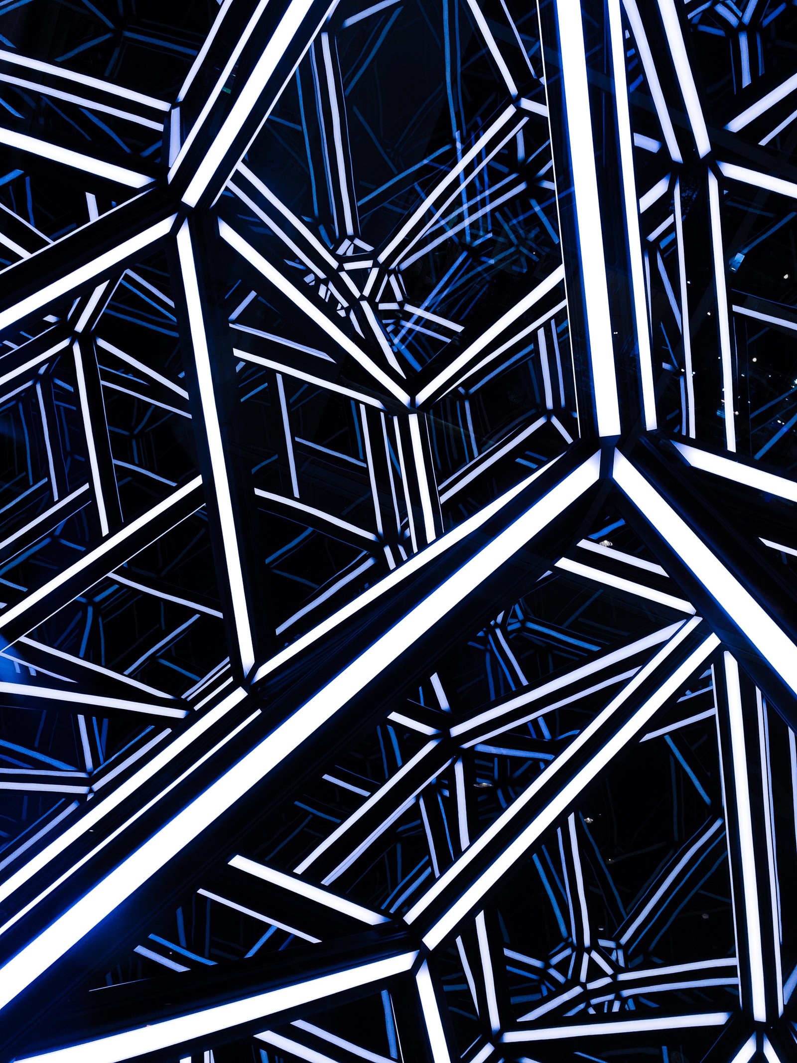 A close up of a blue and white abstract design with lines (modern architecture, architecture, blue, pattern, line)