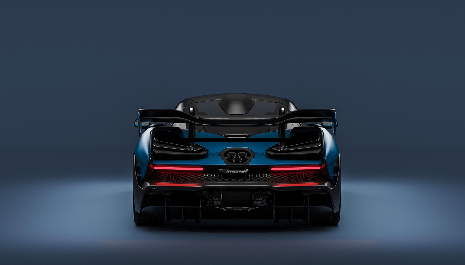 The rear end of a blue sports car with its lights on (bugatti veyron, sports car, car, mclaren automotive, mclaren)