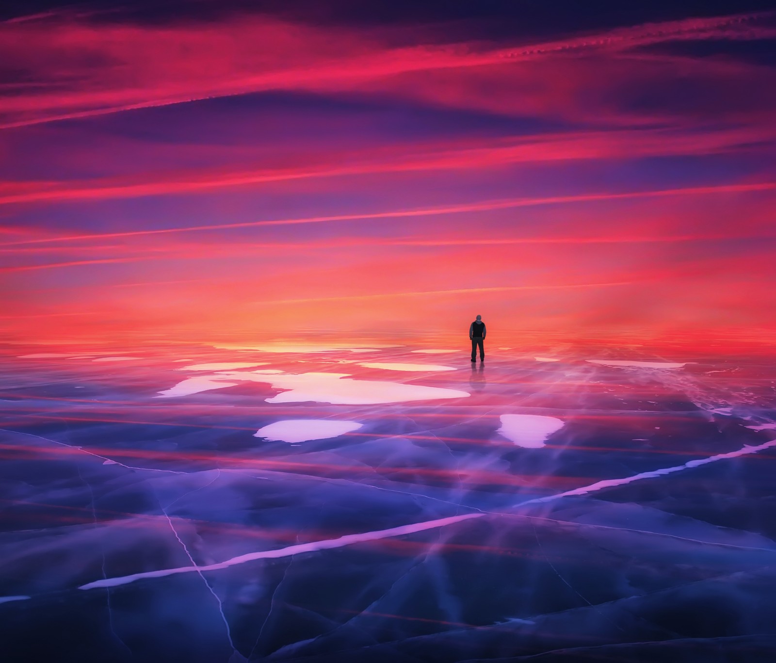 Une personne se tenant sur un lac gelé au coucher du soleil (coucher de soleil, horizon, violet, rouge, atmosphère)