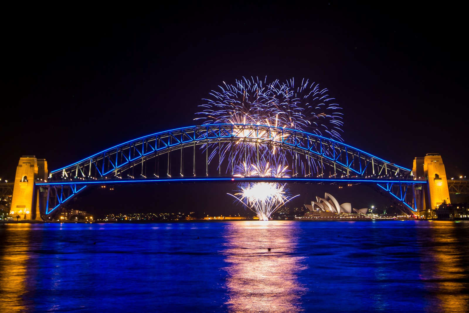 Fireworks over the sydney harbour bridge and opera house (sydney harbour bridge, sydney opera house, bridge, reflection, landmark)