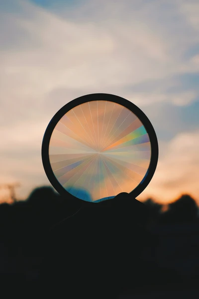 Sunset Through a Circular Lens: Vibrant Colors and Serene Horizon