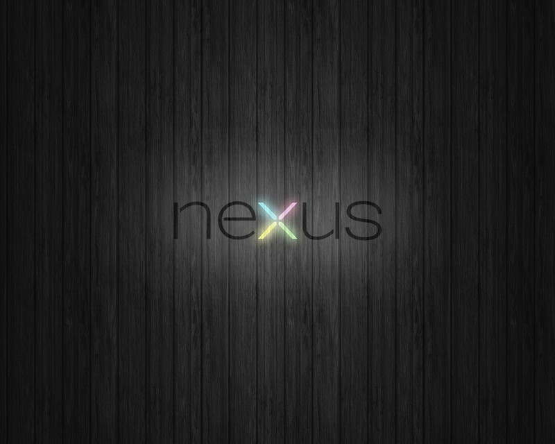 Крупный план деревянной поверхности со словом «nexus» на ней (android, чёрный, тёмный, google)