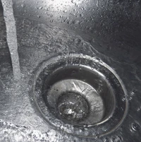 Abstract Water Flow in a Stainless Steel Sink