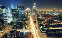 Vibrant Manhattan Skyline at Night: A Breathtaking Urban Cityscape with Skyscrapers and Illuminated Streets