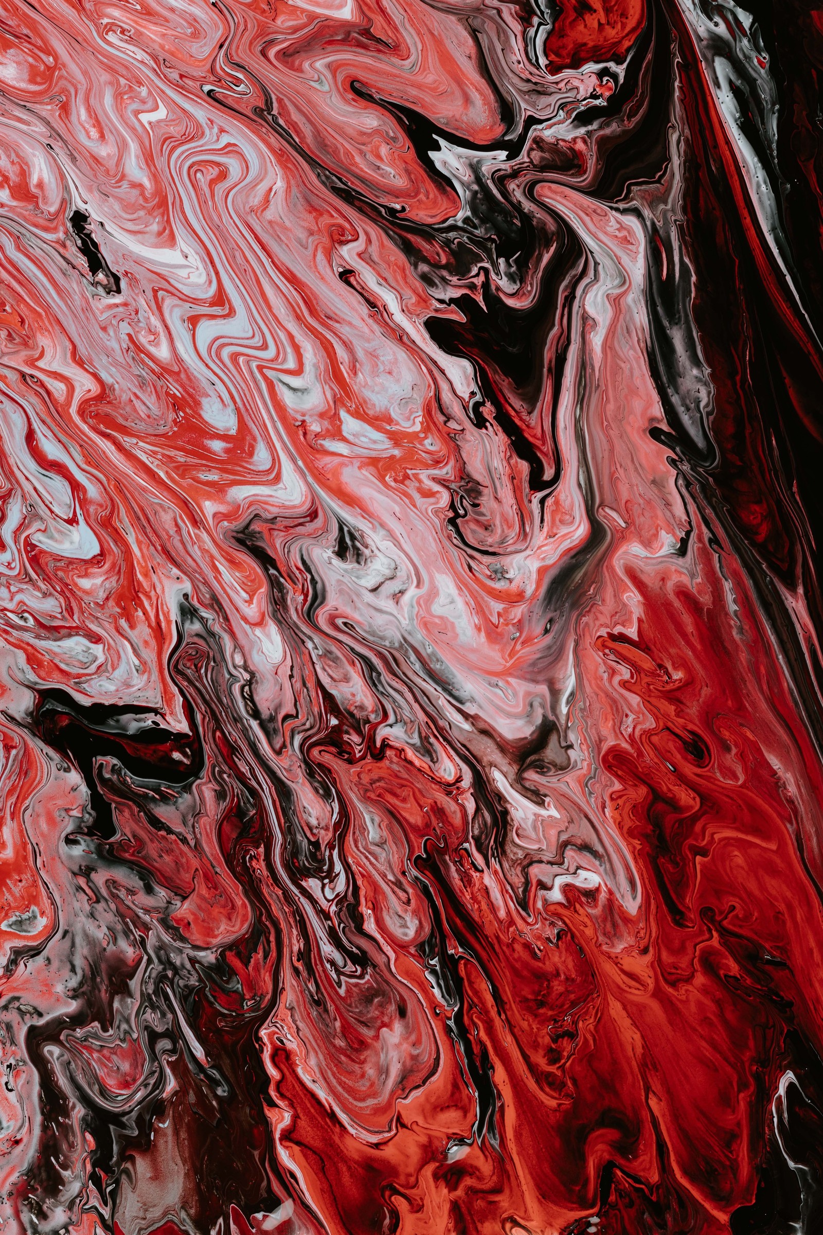 A close up of a red and black painting with a black background (acrylic paint, paint, painting, watercolor painting, art)