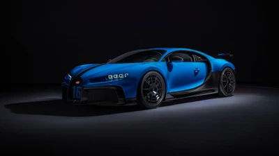 Bugatti Chiron Pur Sport в ярком синем цвете на гладком черном фоне.