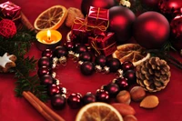 Festive Heart: A Cozy Christmas Arrangement with Ornaments, Natural Decor, and Treats