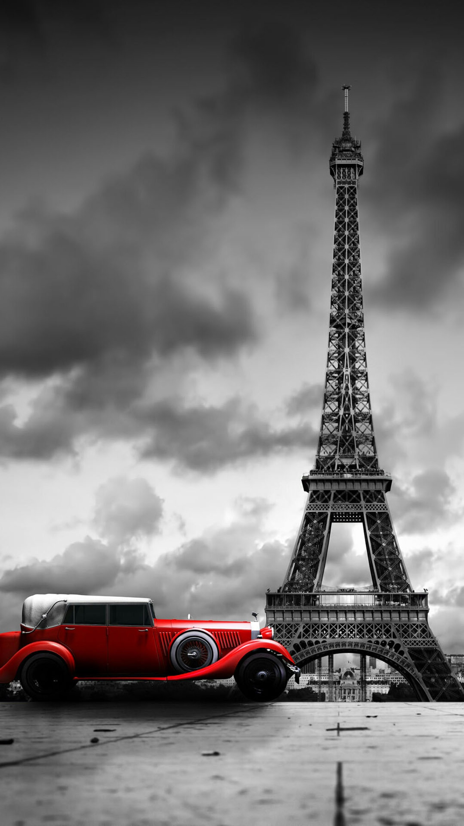 Vue aérienne d'une voiture rouge devant la tour eiffel (architecture, noir, voiture, nuage, tour eiffel)