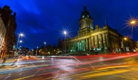 Illuminated Landmark in a Bustling Urban Nightscape