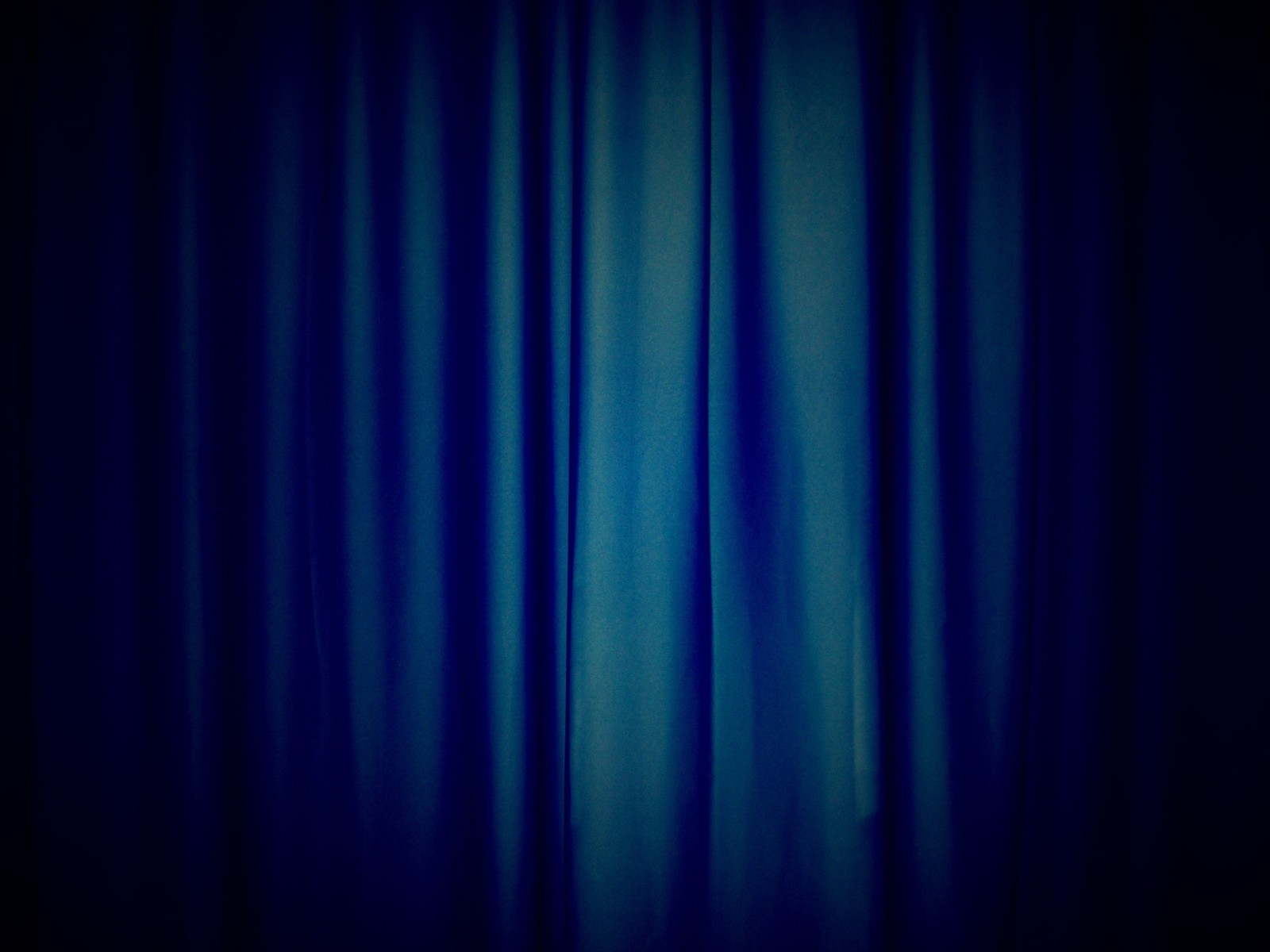 A close up of a blue curtain with a black background (light, blue, black, electric blue, purple)