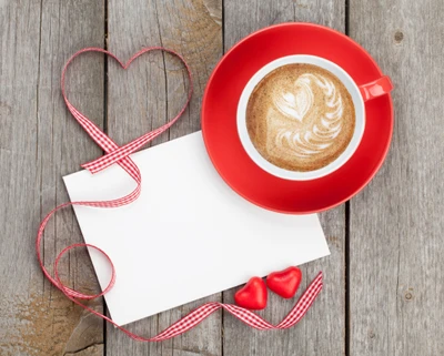 Red Coffee Cup with Heart Latte Art and Decorative Elements